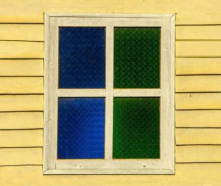 Old window on wood wallの写真素材