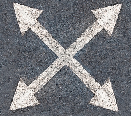 White arrow 4 direction on the road backgroundの写真素材