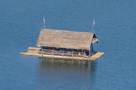 Floating house on riverの写真素材