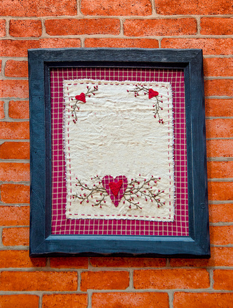 Old wooden frame on brickwallの写真素材