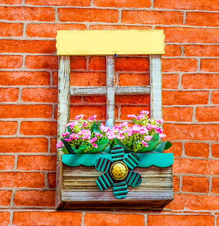 Wooden pot on brickwallの写真素材