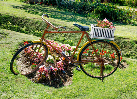 Old bicycle with flowers basketの写真素材