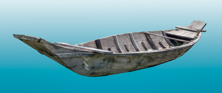 Old wooden boat isolated on cyan background