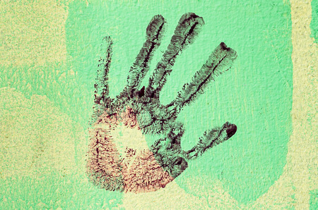 My hand print on wall backgroundの写真素材