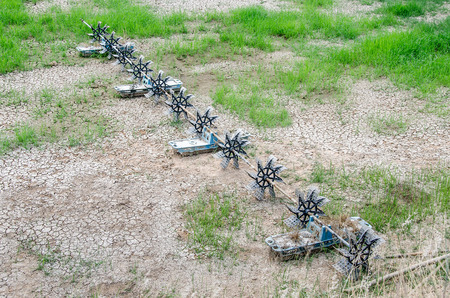 Aerator turbine wheel fill oxygen into shrimp pondの写真素材