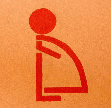 Sign of pregnant women restroom on wallの写真素材