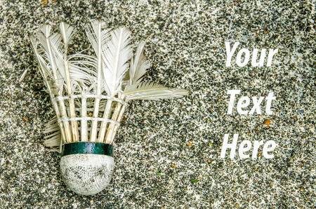 Close-up opld Shuttlecock forming on cement floor backgroundの写真素材