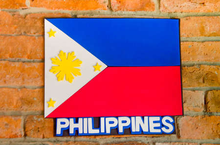 Sighburi,Thailand - OCT 19: Symbol Philippines National Flag on Wall in Robot museum on October 19,2014 in Sighburi province,Thailandのeditorial素材