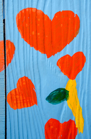 Colorful red heart on wooden backgroundの写真素材