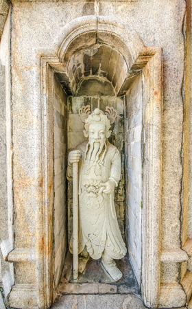 Carving old rock of God chinal in the templeの写真素材