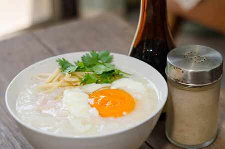 Congee of traditional food Chinese style with soft-boiled eggの写真素材