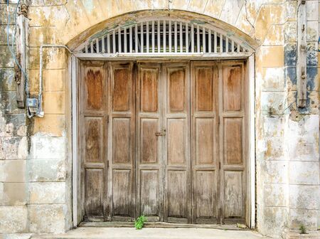 Old wooden door in ancient buildingの写真素材