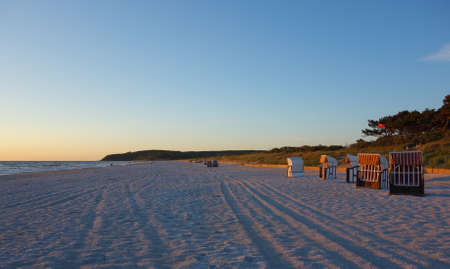 Beach with beach chairs at sunset on Hiddensee Island, Germany
