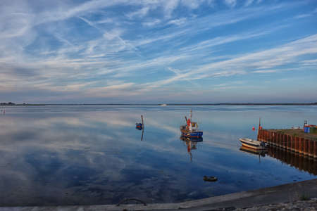 HIDDENSEE, GERMANY - JUNE 9, 2016: Boats at sunset on Hiddensee island, Germany