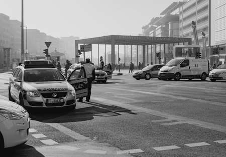 BERLIN, GERMANY - FEBRUARY 14, 2017: Police Stopping The Traffic At Potsdamer Platz, Berlin, black and whiteのeditorial素材