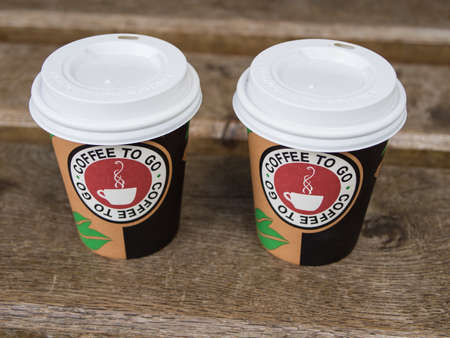 BERLIN, GERMANY - MAY 21, 2017: Coffee To Go Plastic Cup On A Wooden Benchのeditorial素材