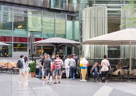 BERLIN, GERMANY - JUNE 5, 2017: Tourists At An Ice Cream Shop At Potsdamer Platz In Berlinのeditorial素材