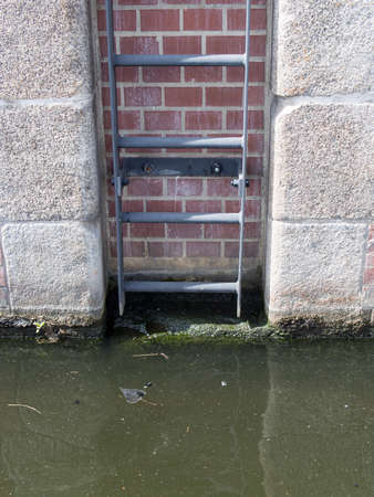 BERLIN, GERMANY - JUNE 21, 2017: Ladder At The Water In Tempelhofer Hafen, Meaning Harbor of Tempelhof In German Language, In Berlinのeditorial素材