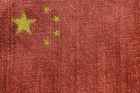 China Textile Industry Or Politics Concept: Chinese Flag Denim Jeans Background Textureの写真素材