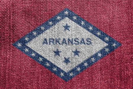 Textile Industry Or Politics Concept: Arkansas Flag Denim Jeans Background Textureの写真素材