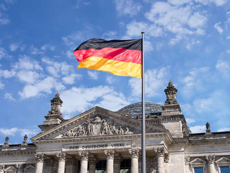 BERLIN, GERMANY - AUGUST 29, 2017: Germany Politics Concept: German Flag In Front of The Reichstag Buildingのeditorial素材