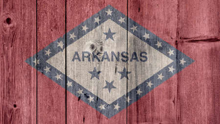 USA Politics News Concept: US State Arkansas Flag Wooden Fenceの写真素材