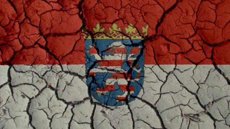 Political Crisis Or Environmental Concept: Mud Cracks With Hesse Flagの写真素材