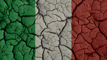 Political Crisis Or Environmental Concept: Mud Cracks With Italy Flagの写真素材