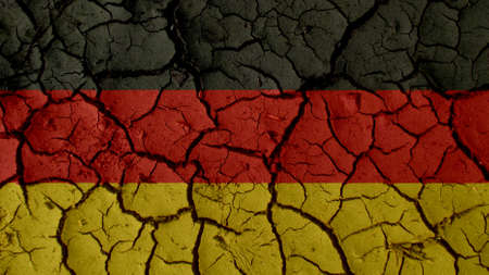 Political Crisis Or Environmental Concept: Mud Cracks With Germany Flagの写真素材