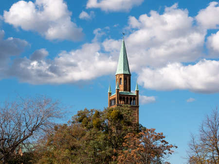 Tower of Neo-Romanesque St. Matthew Church Against A Blue Cloudy Sky In Berlin, Germanyの写真素材