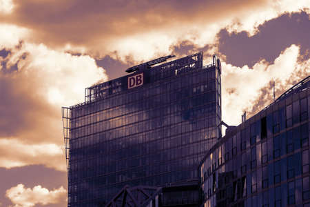 BERLIN, GERMANY - OCTOBER 30, 2018: Top of The BahnTower, Headquarters of German Railway Company Deutsche Bahn, In Berlin, Germany Against A Blue Cloudy Skyのeditorial素材