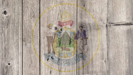 USA Politics News Concept: US State Maine Seal Wooden Fence Backgroundの写真素材