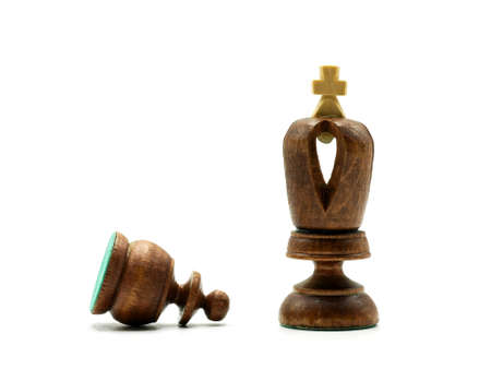 Obedience Chess Concept: Pawn Lying In Front of A King Chess Piece, Isolated On White Backgroundの写真素材