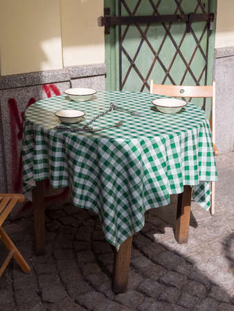 WROCLAW, POLAND - AUGUST 14, 2017: Chained Forks On A Table In Front of Cafe Tradycyjna In Wroclaw, Polandのeditorial素材