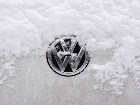 BERLIN, GERMANY - JANUARY 30, 2021: Close-up of A Snow-capped VW Logo On A Car In Berlin, Germanyのeditorial素材