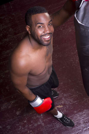 A boxer pauses and looks up at the cameraの写真素材