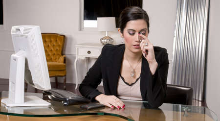 A pretty receptionist endures painの写真素材