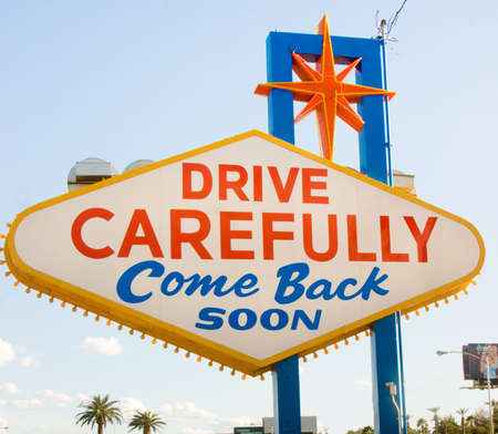 A sign asks you to return soon as you leave Las Vegasの写真素材