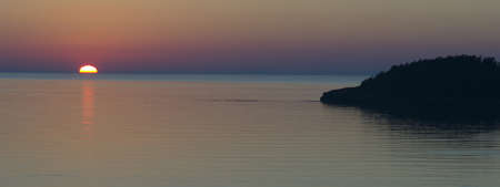 The Sun goes down over the Pacific Oceanの写真素材