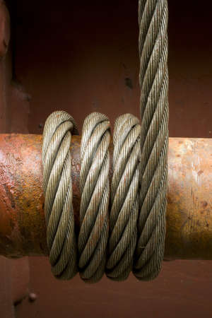 Steel cable wrapped around a tensionerの写真素材