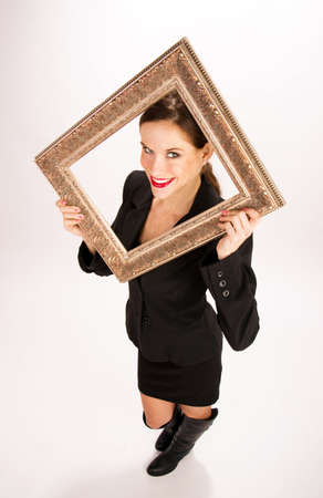 A beautiful brunette has a frame over her headの写真素材