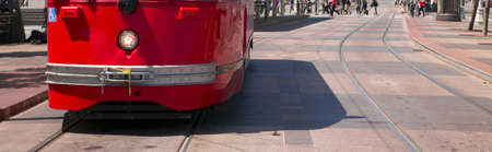 A Red San Francisco Trolley Car moves through the streetの写真素材