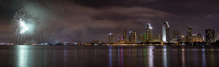 San Diego California City Skyline at Night and Fireworks Celebration Observed from Coronado Islandの写真素材