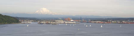 An evening boat race is conducted on the waters of Puget Sound Tacoma Washingtonのeditorial素材