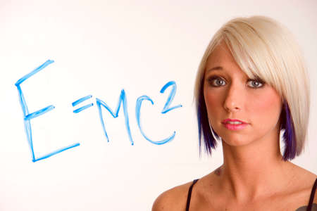 An Algebra equation on glass in front of woman
