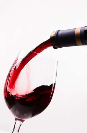 Wine is poured into stemmed glass liquid refreshment alcoholの写真素材