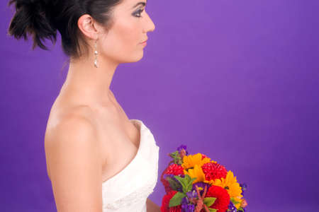 Beautiful Brunette Bride Profile On Vibrant Purple Backgroundの写真素材