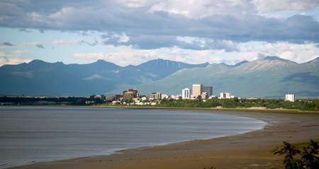 Sandy beach bay Anchorage Alaska downtown city skylineの写真素材