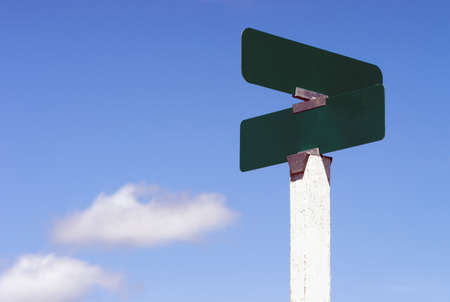 Blank street signs against blue sky ready for your creativityの写真素材