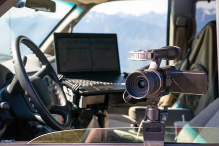 Camera and Laptop mounted on van windowの写真素材